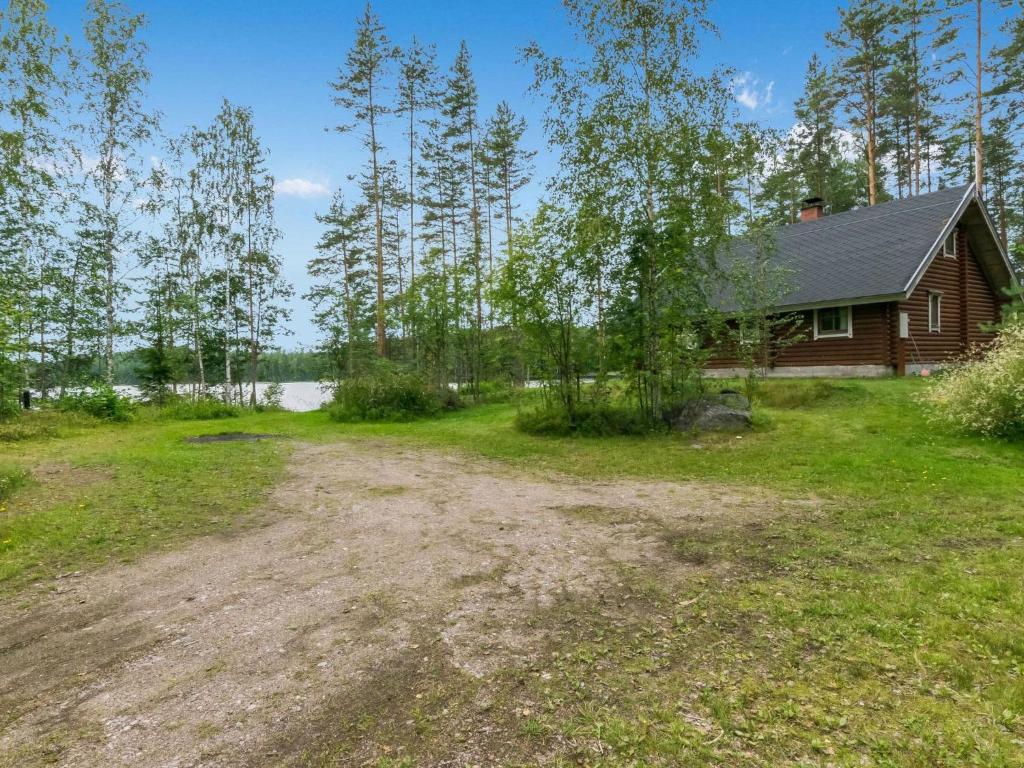 an empty yard in front of a house at Holiday Home Niitsinniemi by Interhome in Laamala