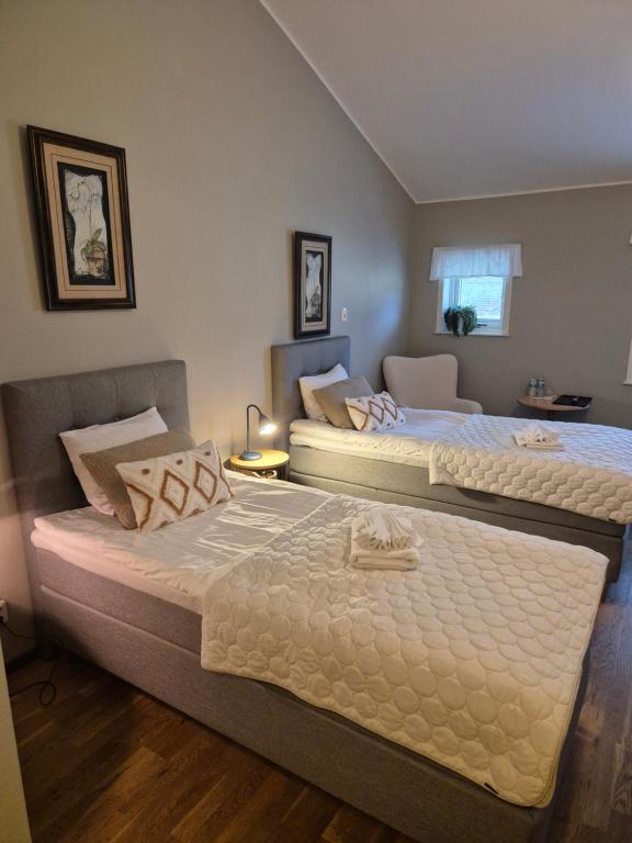 Postel nebo postele na pokoji v ubytování Hotel Fritza