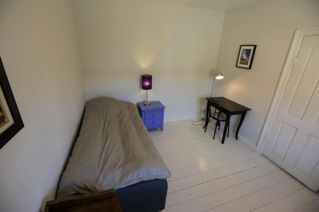 Postel nebo postele na pokoji v ubytování AvalonBnB