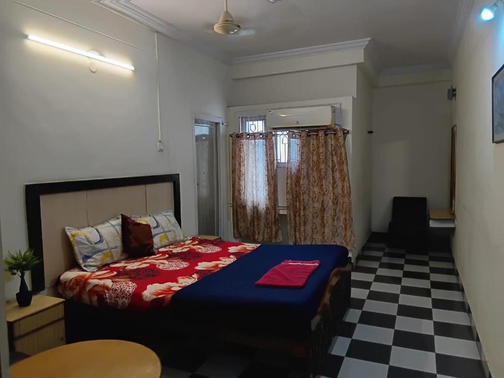 Postel nebo postele na pokoji v ubytování lakshmi inn lodge