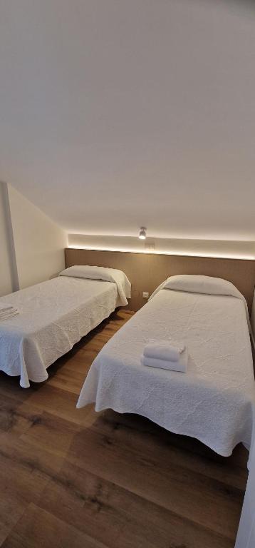 Postel nebo postele na pokoji v ubytování Apartamentos Suaces