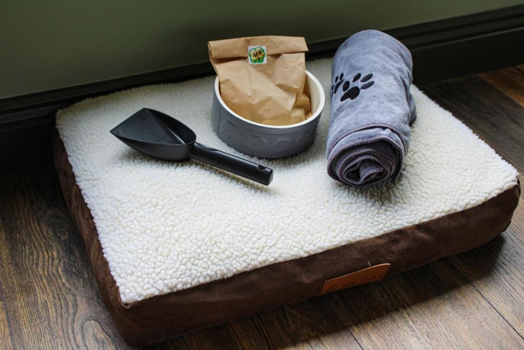 a towel and a utensil sitting on a table at Wild Hideaways Luxury Lodges and Eco Spa in Bantry