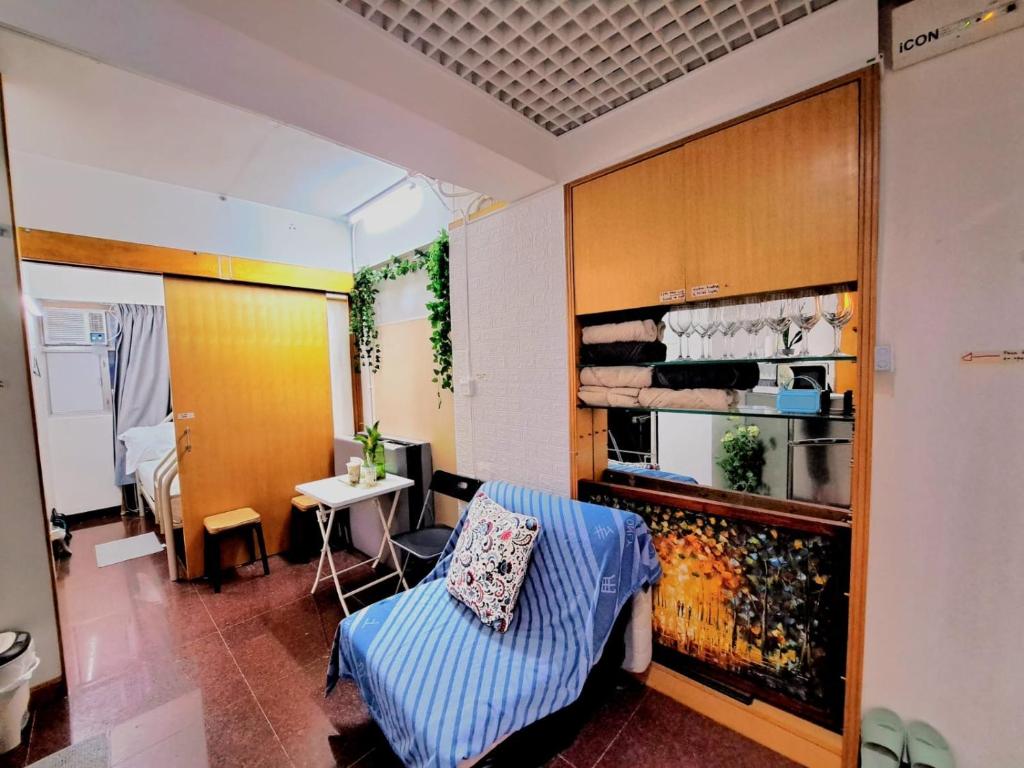 a living room with a couch and a table at Cozy full Apartment 2 bedroom central area in Hong Kong