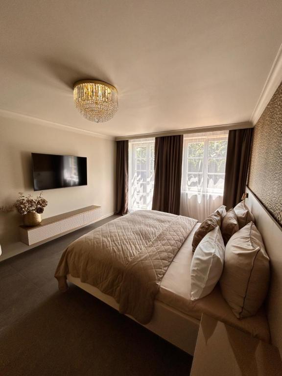 Postel nebo postele na pokoji v ubytování Royal Apartmány