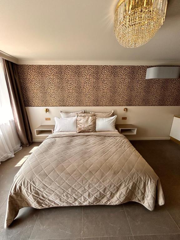 Postel nebo postele na pokoji v ubytování Royal Apartmány