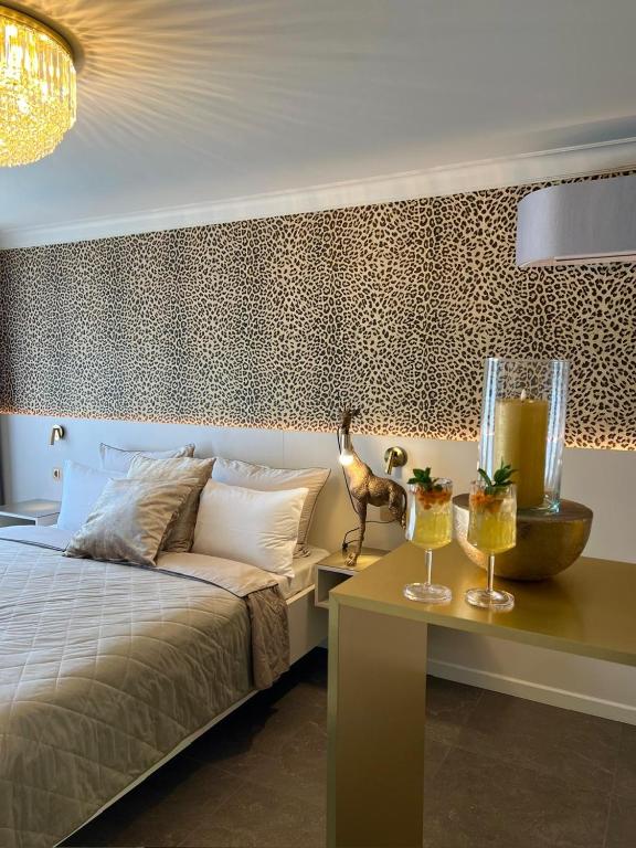 Postel nebo postele na pokoji v ubytování Royal Apartmány
