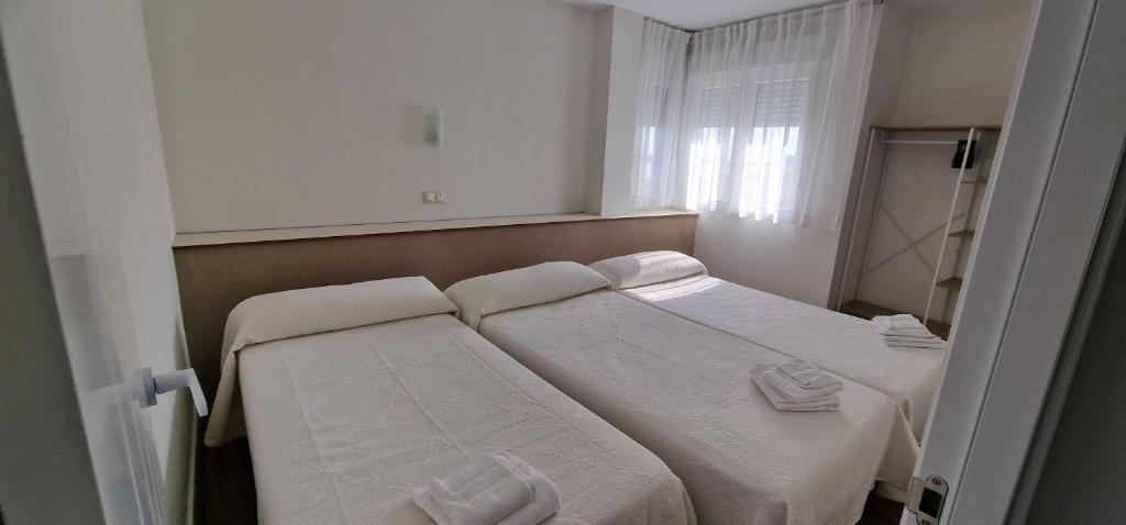 Postel nebo postele na pokoji v ubytování Apartamentos Suaces