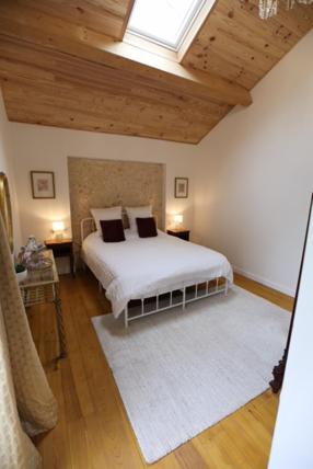 Postel nebo postele na pokoji v ubytování The Lodge Gite