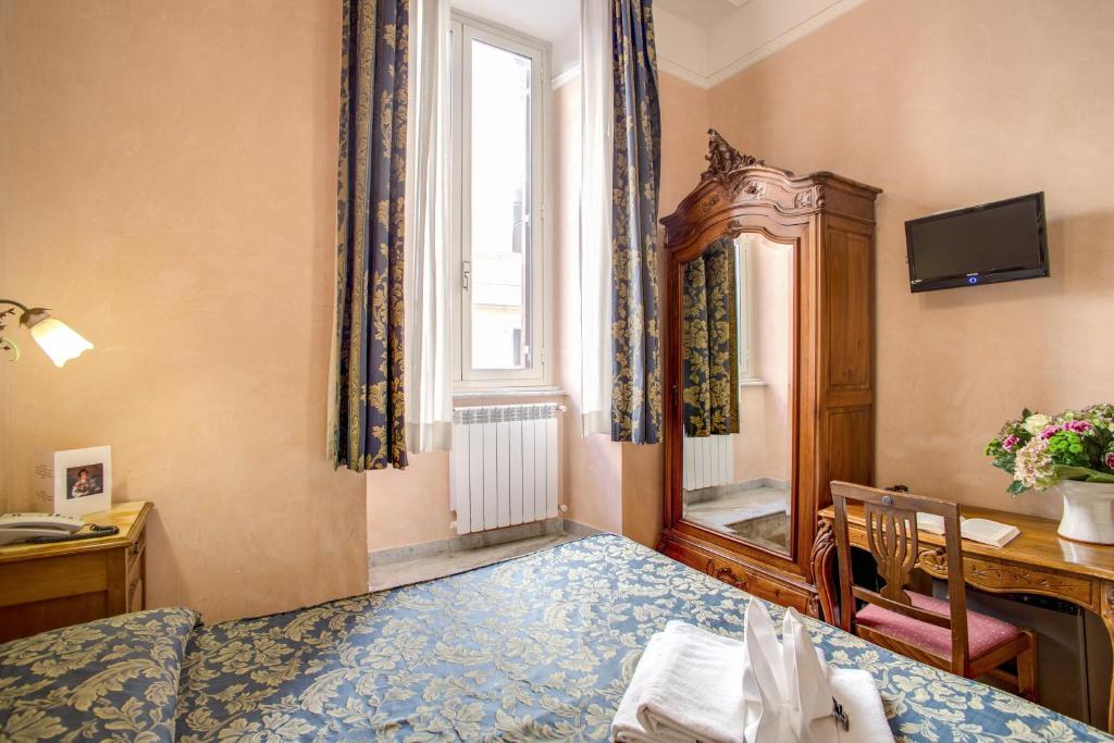 Postel nebo postele na pokoji v ubytování Hotel Caravaggio