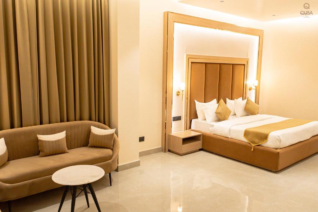 Postel nebo postele na pokoji v ubytování Hotel QUBA