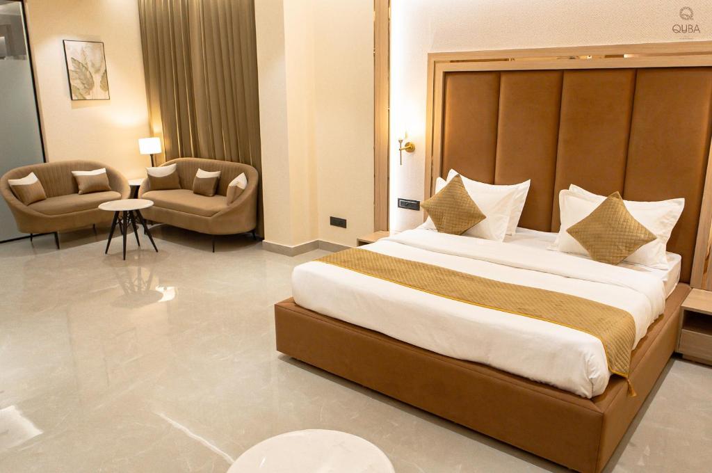 Postel nebo postele na pokoji v ubytování Hotel QUBA