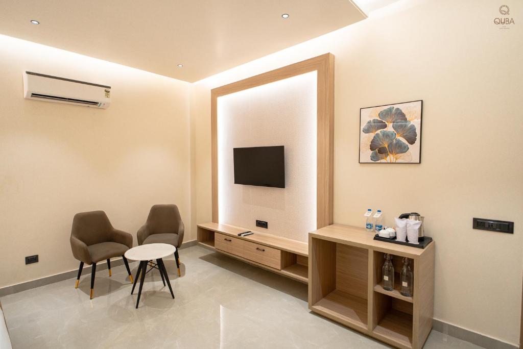 TV a/nebo společenská místnost v ubytování Hotel QUBA