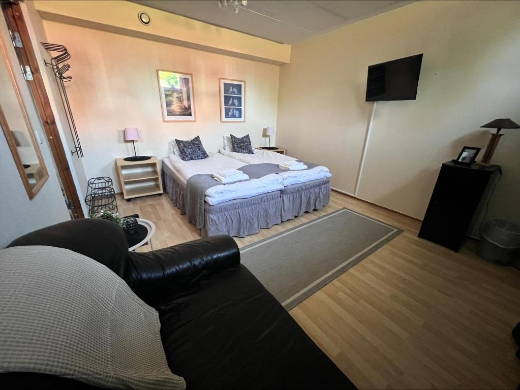 Postel nebo postele na pokoji v ubytování Målkullorna Hostel
