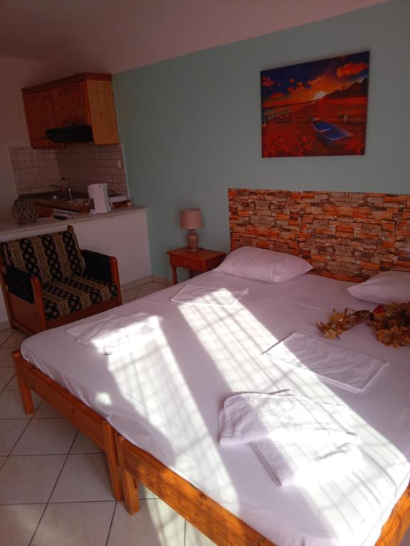 Postel nebo postele na pokoji v ubytování Giola aparments and studios 2
