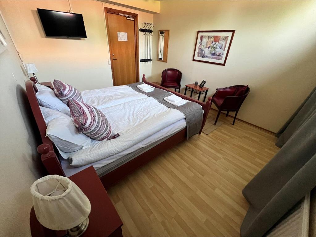 Postel nebo postele na pokoji v ubytování Målkullorna Hostel