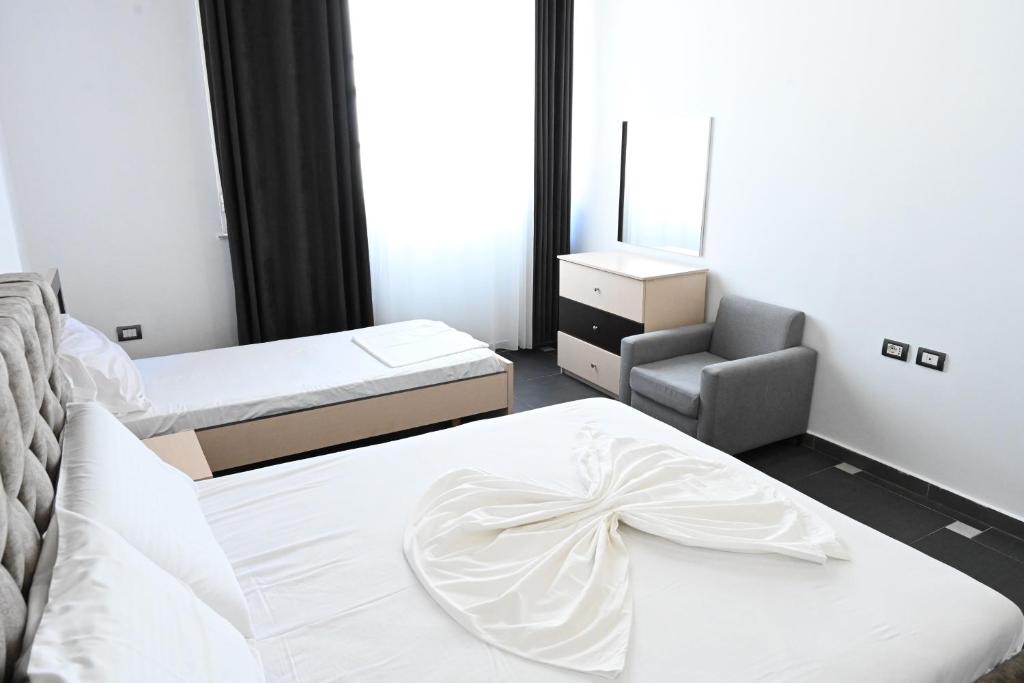 Postel nebo postele na pokoji v ubytování Tafi Appart Hotel & Art Space