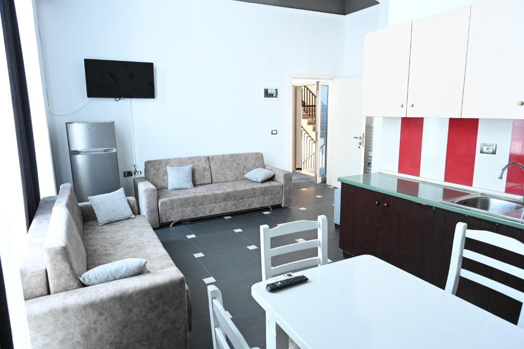 Kuchyň nebo kuchyňský kout v ubytování Tafi Appart Hotel & Art Space
