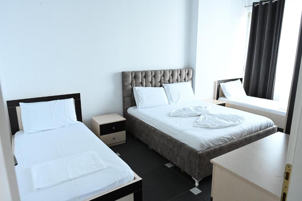 Postel nebo postele na pokoji v ubytování Tafi Appart Hotel & Art Space