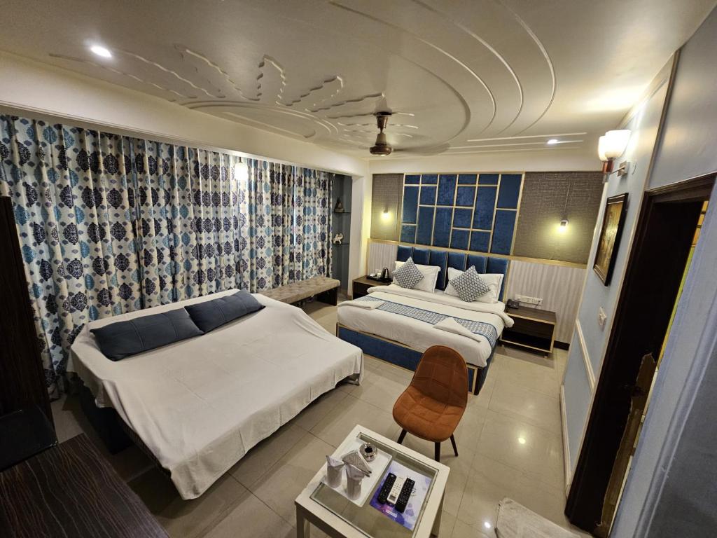 Postel nebo postele na pokoji v ubytování Hotel Oppera Delhi International Airport