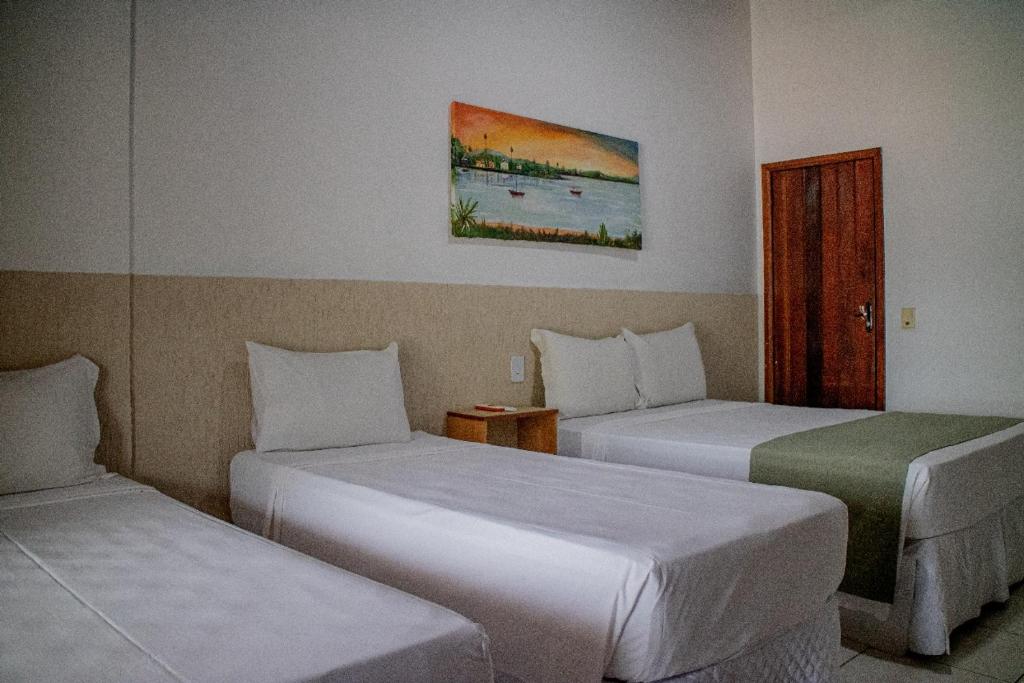 Postel nebo postele na pokoji v ubytování Hotel Malibu