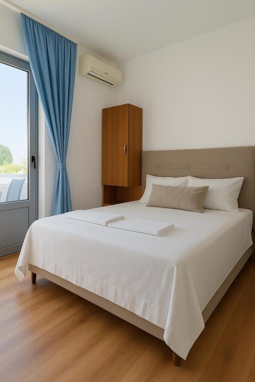 Postel nebo postele na pokoji v ubytování Apartments Hija