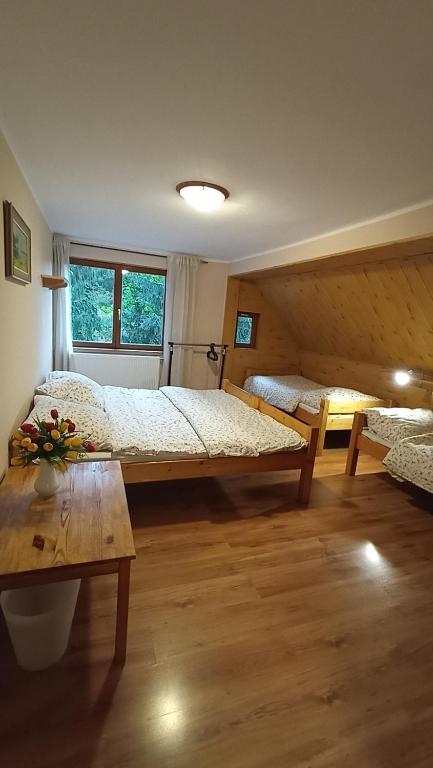 Postel nebo postele na pokoji v ubytování Horská Chalupa Nad Zubačkou