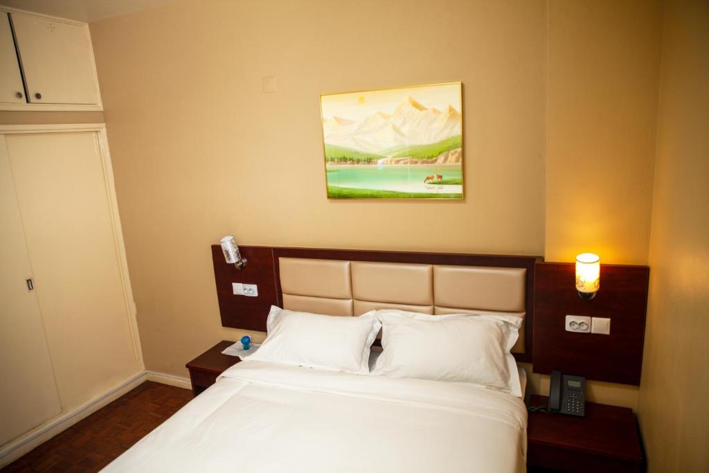 Postel nebo postele na pokoji v ubytování Hotel Mirava