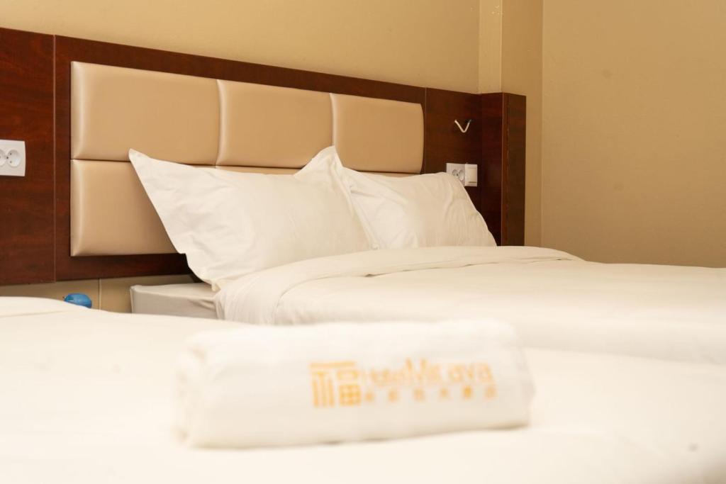 Postel nebo postele na pokoji v ubytování Hotel Mirava