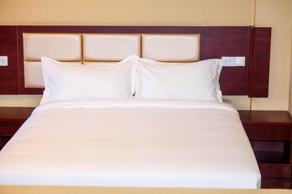 Postel nebo postele na pokoji v ubytování Hotel Mirava