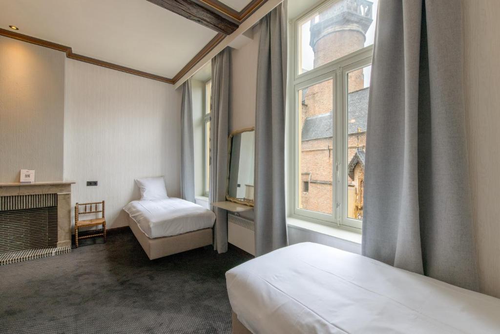 Postel nebo postele na pokoji v ubytování Hotel Lucca