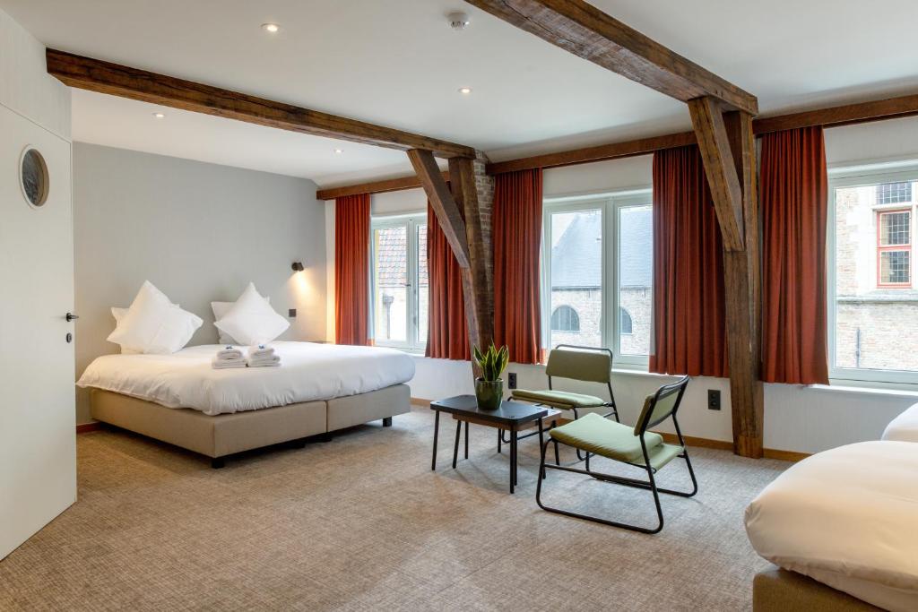 Postel nebo postele na pokoji v ubytování Hotel Lucca