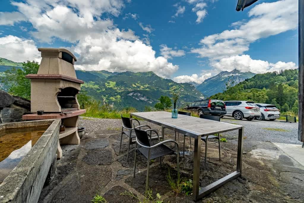 a table and chairs next to a pizza oven at Cozy Studio With Terrace Bbq Mountain View in Ober Stafel
