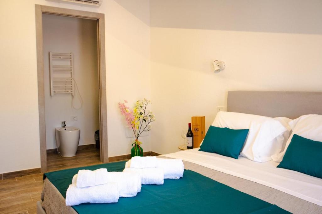 Postel nebo postele na pokoji v ubytování La Corte di Giovanni - Guest House