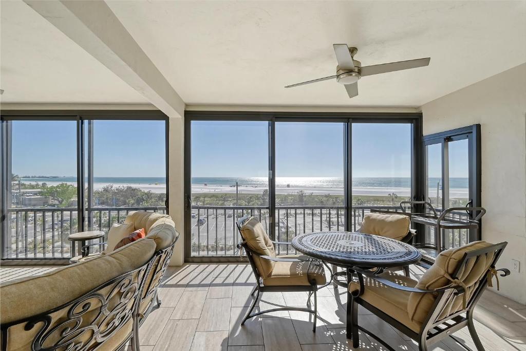 a living room with a table and chairs at Crescent Royale Condominiums 501 in Siesta Key