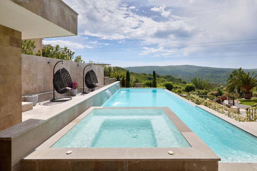 a swimming pool in a villa with a view at Villa Oaza with Outdoor Pool in Kotor