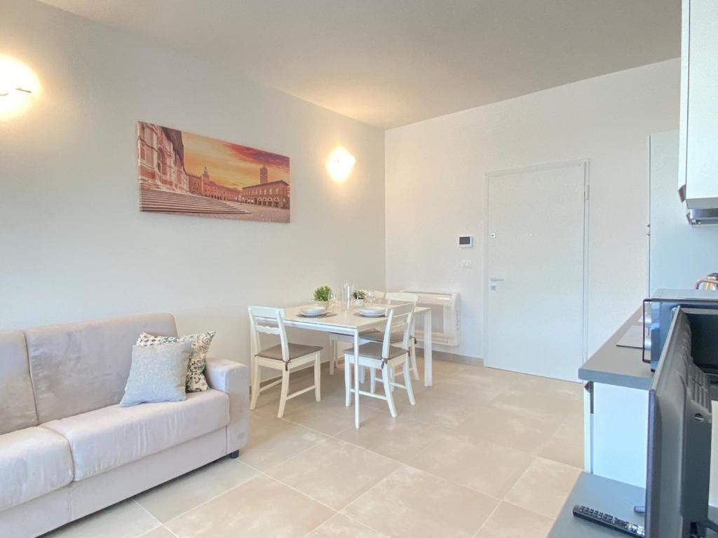 a living room with a couch and a table at Suite Emilia 6 in Bologna