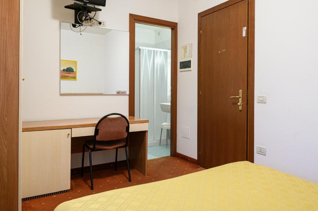Postel nebo postele na pokoji v ubytování Hotel Due Ragni e Ristorante