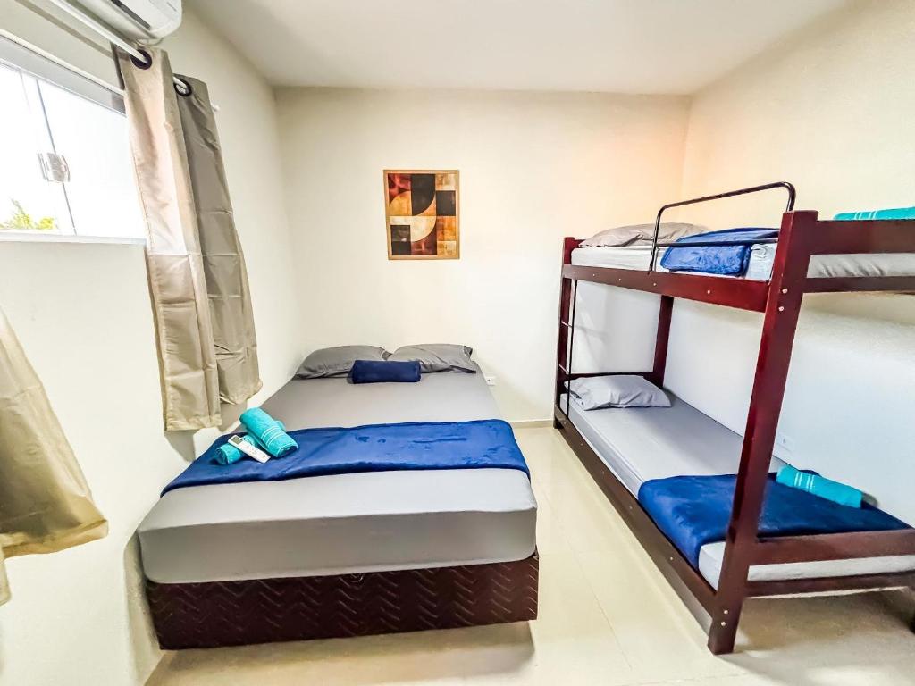 Uma cama ou camas num quarto em Vila Imper Host Balsas- Apês com Wi-fi I A/C a 3 min. do Mix Mateus