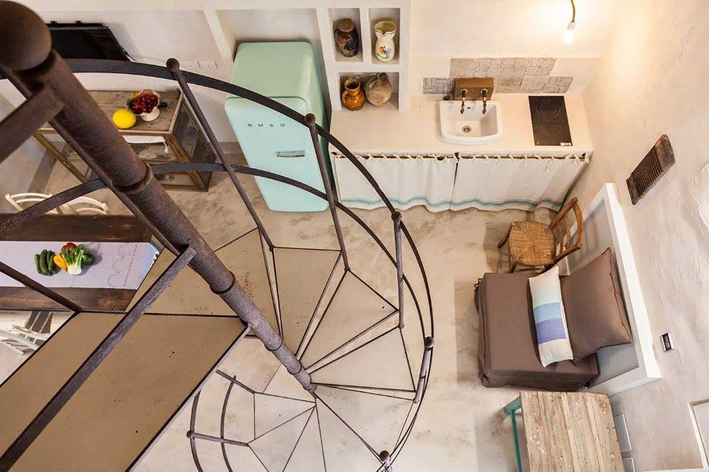 an overhead view of a room with a table and chairs at Masseria Borgo Sentinella in Torre dell'Orso