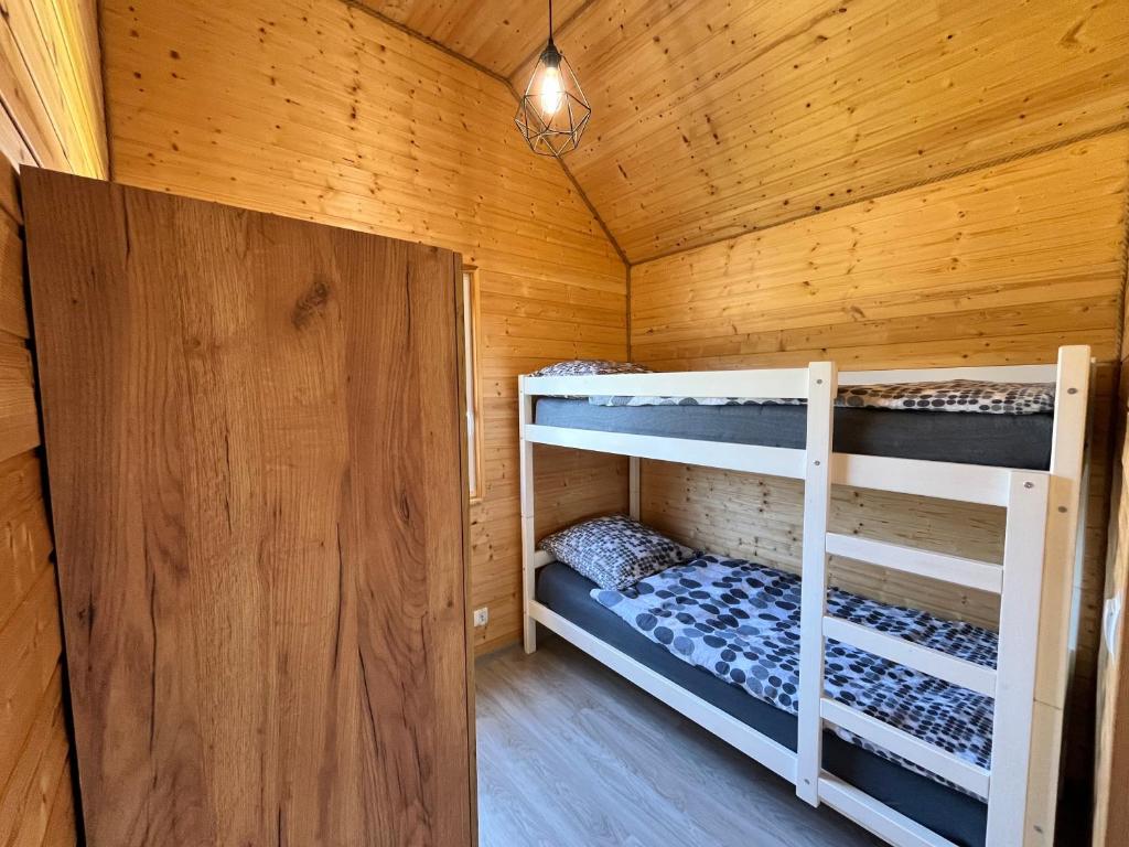 Postel nebo postele na pokoji v ubytování Domki Dafi