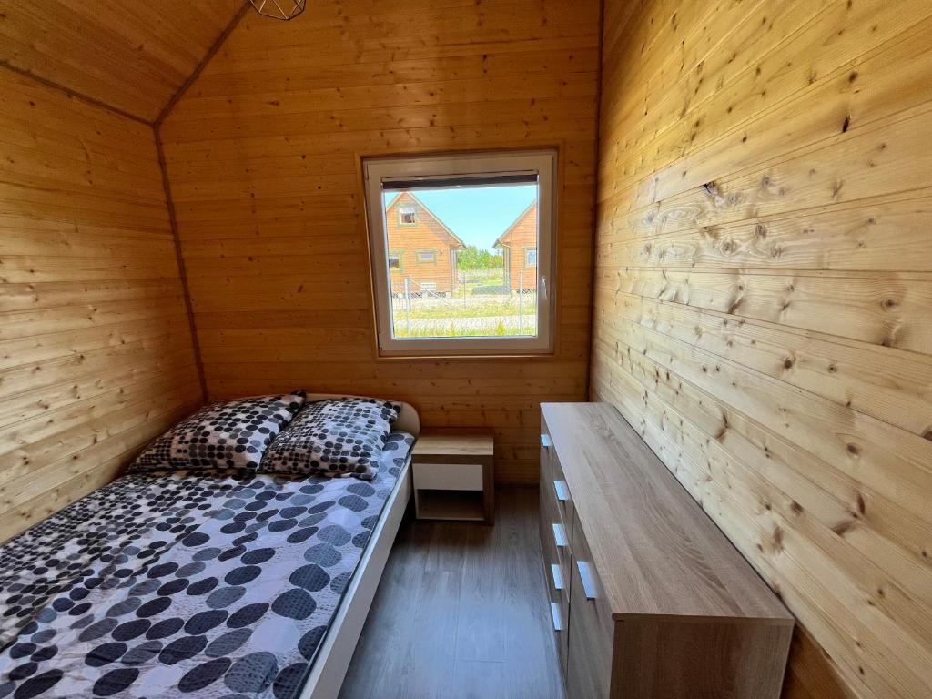 Postel nebo postele na pokoji v ubytování Domki Dafi