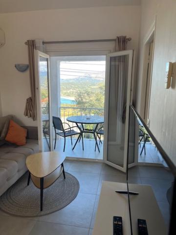 a living room with a couch and a table at Résidence Colombara in Cargèse