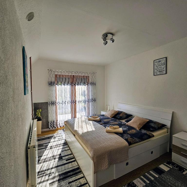 Posteľ alebo postele v izbe v ubytovaní Apartment Topalović