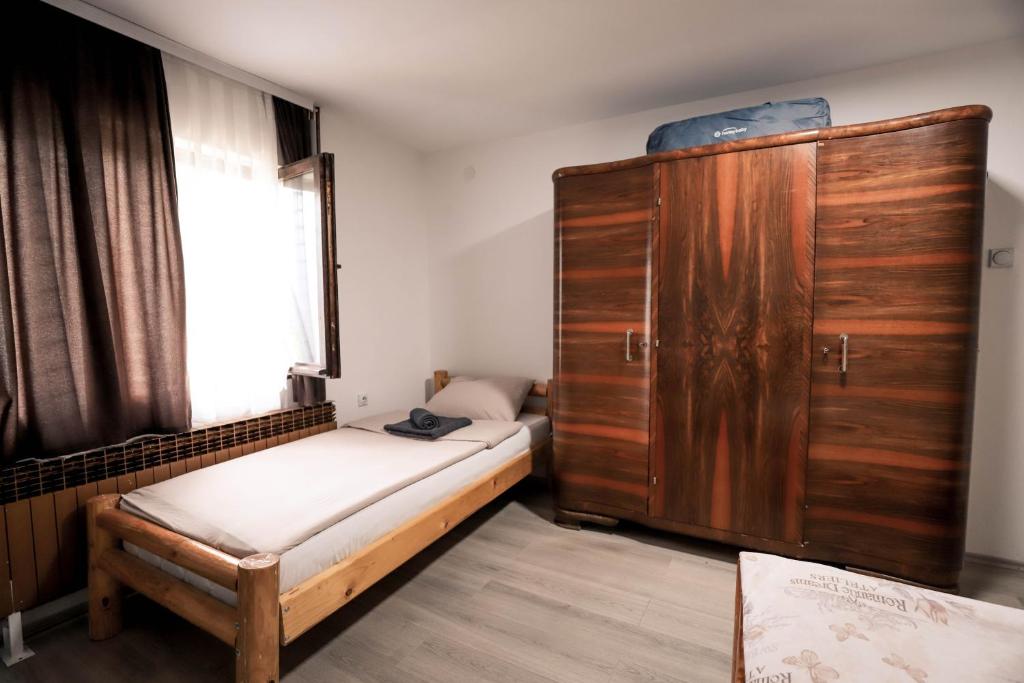 Postel nebo postele na pokoji v ubytování Jaćimov Konak