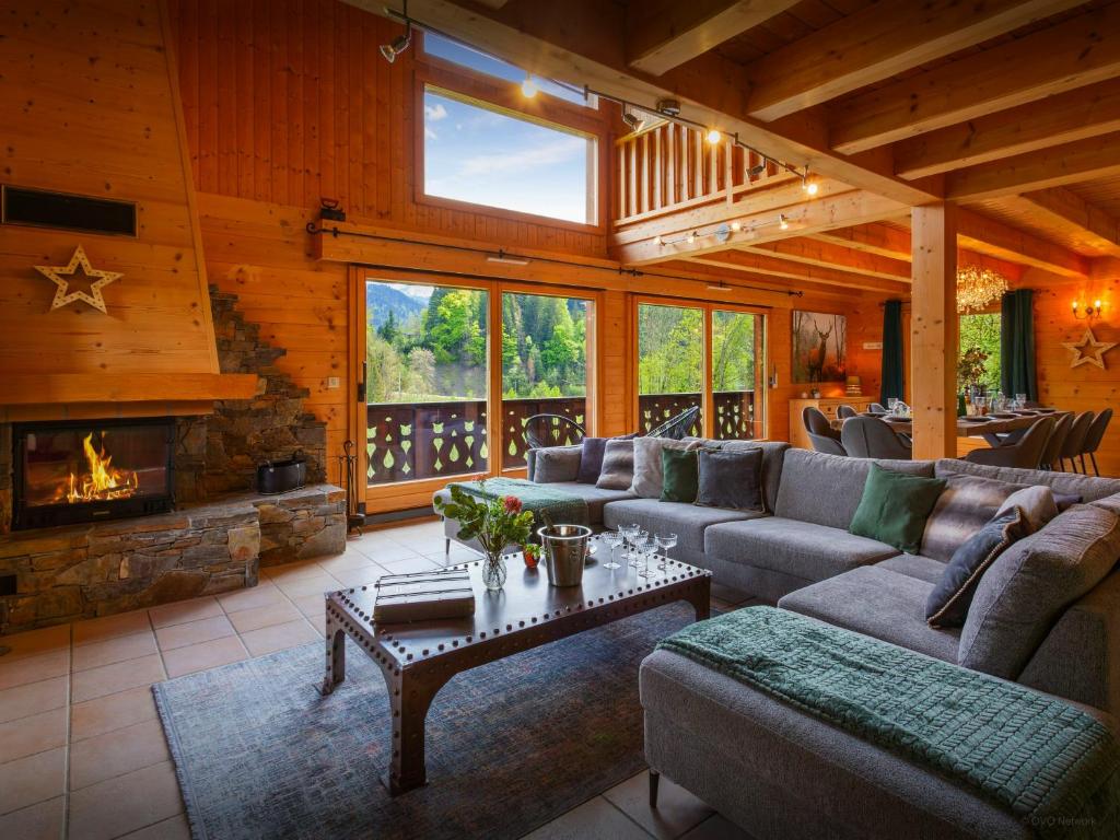 a living room with couches and a fireplace at Chalet Isla de Lux - OVO Network in La Côte dʼArbroz