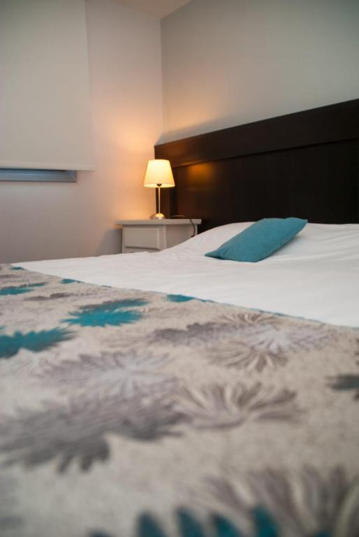 Postel nebo postele na pokoji v ubytování Links Apart Hotel