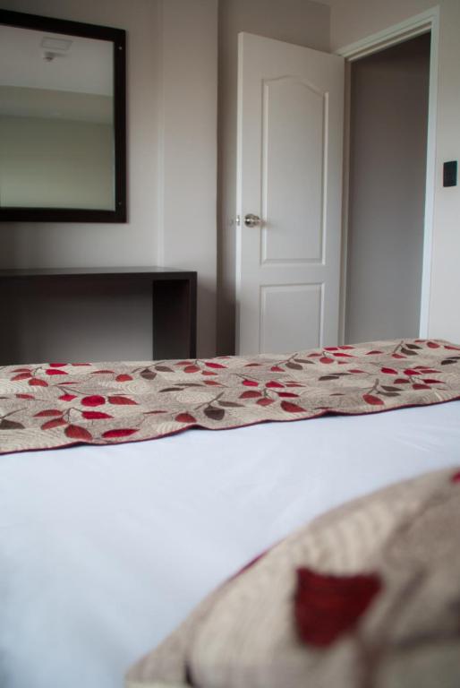 Postel nebo postele na pokoji v ubytování Links Apart Hotel