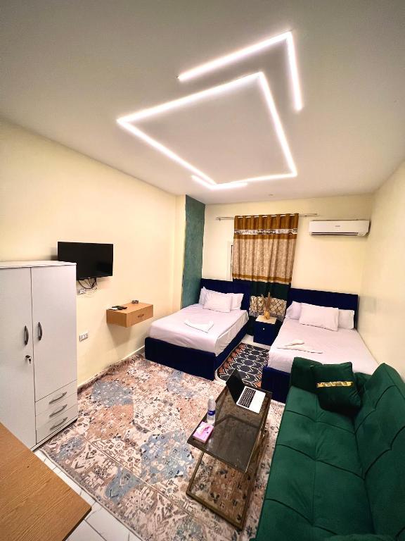 Postel nebo postele na pokoji v ubytování Farsha Pyramids Inn
