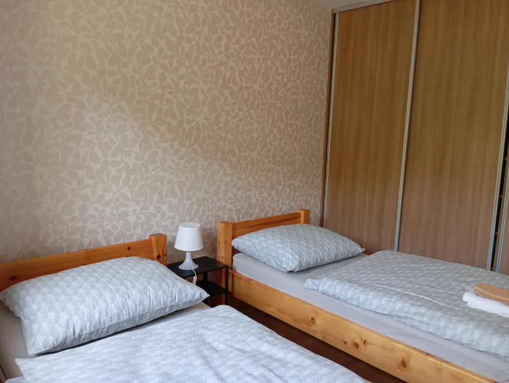 Postel nebo postele na pokoji v ubytování Tri Korunky