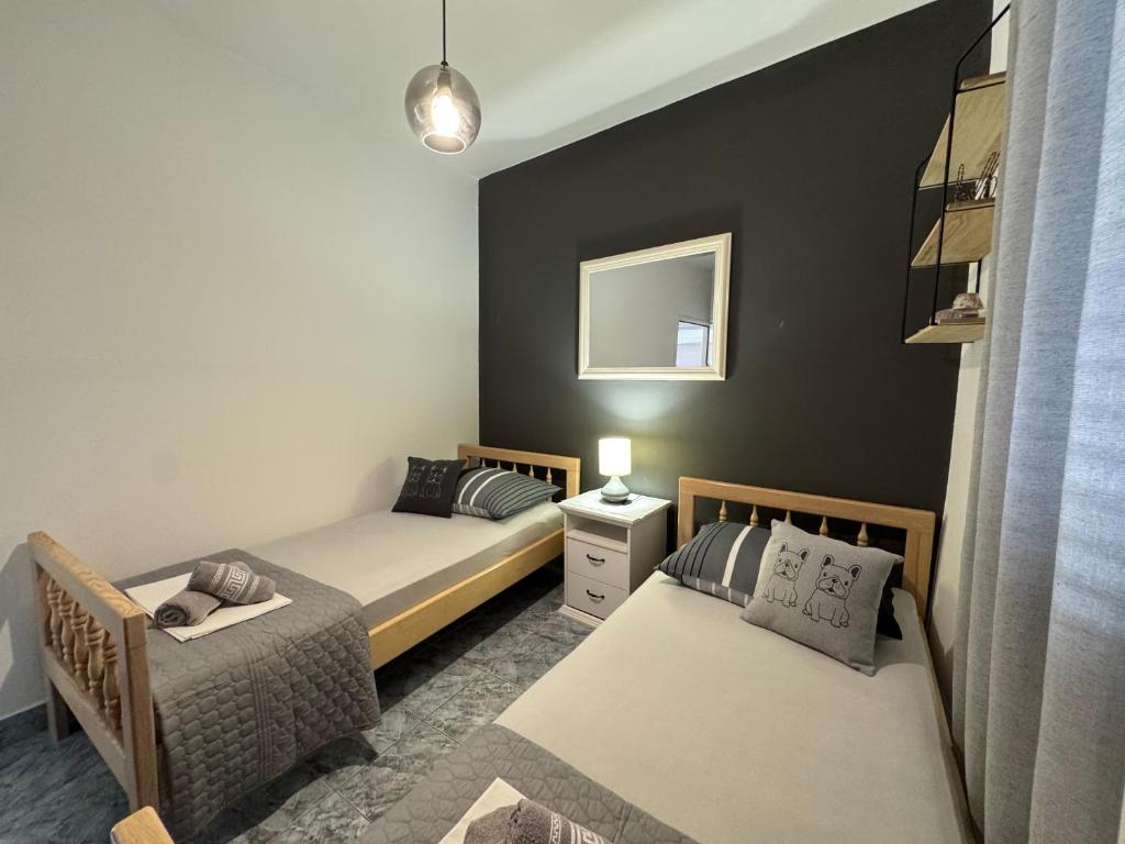 Postel nebo postele na pokoji v ubytování Apartmani Meri